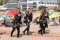 Malgrat de Mar, Catalonia, Spain, August 2018. A group of very tired divers returns after diving.