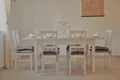 Mali Losinj, Croatia 2020. Dining room interior with table and chairs with dishes. Royalty Free Stock Photo