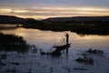 Malian Fishermen Hauling His Fishing Net At A Late Sunset In Bamako Royalty Free Stock Photo