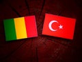 Malian flag with Turkish flag on a tree stump