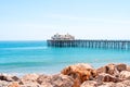 Malibu Beach pier, California. Postcard view, blue sky and beautiful ocean waves