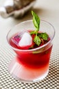 Malibu Sunset Cocktail with mint leaves. Royalty Free Stock Photo