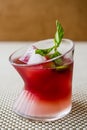 Malibu Sunset Cocktail with mint leaves. Royalty Free Stock Photo