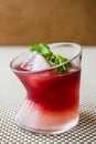 Malibu Sunset Cocktail with mint leaves. Royalty Free Stock Photo