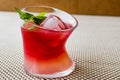 Malibu Sunset Cocktail with mint leaves. Royalty Free Stock Photo