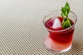 Malibu Sunset Cocktail with mint leaves. Royalty Free Stock Photo