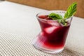 Malibu Sunset Cocktail with mint leaves. Royalty Free Stock Photo