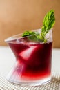 Malibu Sunset Cocktail with mint leaves. Royalty Free Stock Photo
