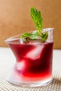 Malibu Sunset Cocktail with mint leaves. Royalty Free Stock Photo