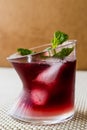 Malibu Sunset Cocktail with mint leaves. Royalty Free Stock Photo