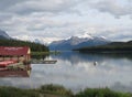 Maligne Lake, water and mountains in the background and a Boat House in the dock