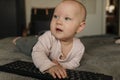 Mall child grabs a mouse and keyboard, internet addiction from an early age Royalty Free Stock Photo