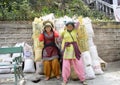 Wo Nepali women working as a porter seen carrying cements in gunny bag