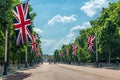 Union Jack flags and tourists on the Mall in London