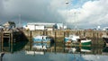 Mallaig, United Kingdom - 16 OCTOBER 2019 : View of Mallaig harbor during cloudy afternoon.