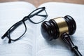 Mallet And Eyeglasses On Open Legal Book Royalty Free Stock Photo