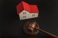 Mallet of judge and model house. Real estate auction. Confiscated housing Royalty Free Stock Photo