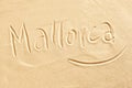 Mallorca handwritten in golden beach sand Royalty Free Stock Photo
