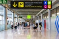 Passengers move towards boarding at Palma de Mallorca airport following the directions