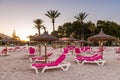 Sunbeds with umbrellas at the Playa de Alcudia beach in Mallorca, Spain