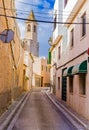 Majorca, narrow street in Santanyi with view of church spire Royalty Free Stock Photo