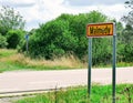 Malmedy village sign on french asphalt car road on a sunny summer day. Royalty Free Stock Photo