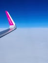 Malmo, Sweden - August 22, 2022: Left wing of WizzAir airplane after taking off above Malmo Sturup airport heading to Belgrade, Royalty Free Stock Photo