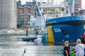 Swedish coast guard brings up to deck a sunken sailboat