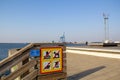 MalmÃÂ¶, Sweden - April 6, 2019: A man fishing on a pier even if the sign says fishing is forbidden