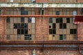 Broken windows at a old abandoned wharf building.. Royalty Free Stock Photo