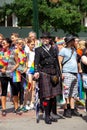 A senior man dressed in Scottish way in pride parade