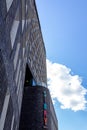 MalmÃÂ¶, Sweden - July 11, 2018: The facade of Story Hotel rising towards the clear blue sky with fluffy cloads on a bright summer