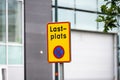 Lastplats sign marking a loading zone by a building.. Royalty Free Stock Photo