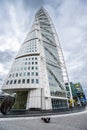 Person on the ground photographing Turning Torso high rise..