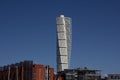 MalmÃÂ¶, Sweden - May 11, 2019: Turning Torso, a white twisted skyscraper, is visible high above the other buildings in the city