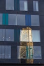 MalmÃÂ¶, Sweden - November 25, 2018: The reflection of the skyscraper Turning Torso is visible in the black facade of World Trade