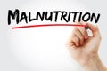 Malnutrition text with marker Royalty Free Stock Photo