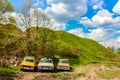 Maloyaroslavets, Russia - May 2016: Hill of an ancient settlement in Maloyaroslavets and old Soviet cars