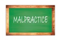 MALPRACTICE text written on green school board