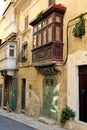 Malta august 2015 Valletta street ornamental plants on a stone house