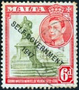MALTA - CIRCA 1948: A stamp printed in Malta shows statue of Manoel de Vilhena and King George, circa 1948. VI