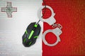 Malta flag and handcuffed computer mouse. Combating computer crime, hackers and piracy