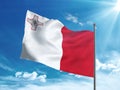 Malta flag waving in the blue sky