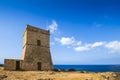 Malta - Ghajn Tuffieha watchtower at Golden Bay on a nice sunny day Royalty Free Stock Photo