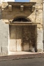 Arched rusty doorway near Gillieru Harbour Malta