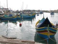Colorful fishing boats in the port. Malta. Marsaxlokk.