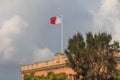Malta national flag is waving on central bank of malta building. Malta Valletta