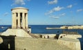 Malta, Valletta, Lower Barrakka Gardens, view on the Siege Bell Memorial and Ricasoli East Breakwater