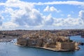 Malta, Valletta. Senglea, a fortified grand harbor under a blue sky with few clouds. Panoramic view, town background.