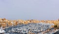 Malta. Yachts at Birgu waterfront. Birgu cityscape on a sunny day.